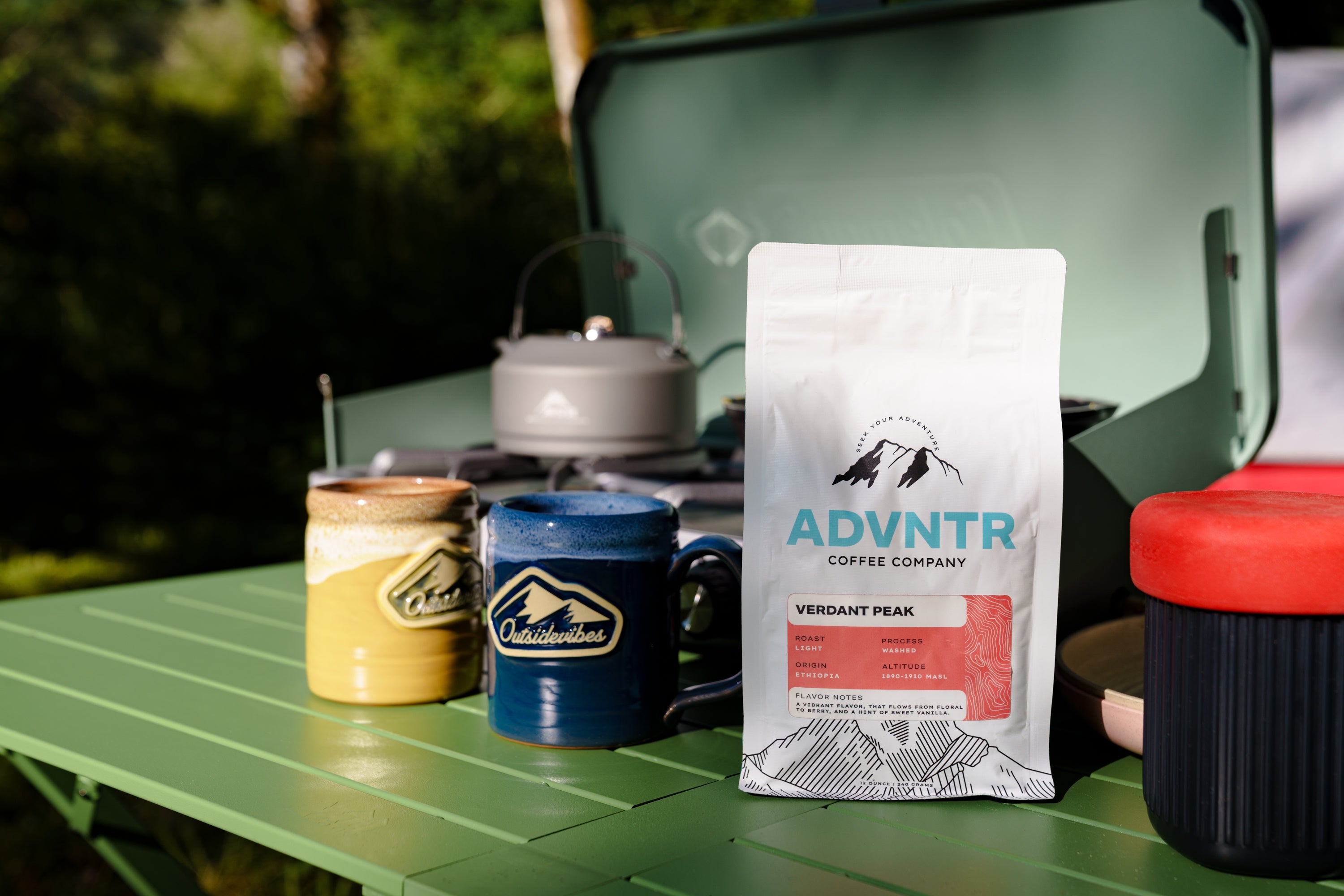 adventure coffee company camping table and mugs